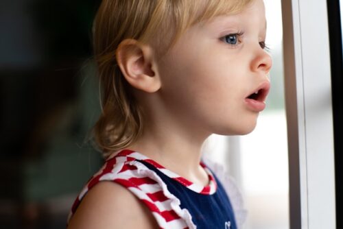 child looking out window